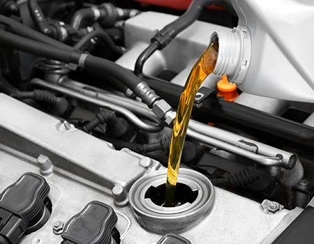 A photo of new oil being poured into an engine